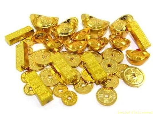gold bars and coins as amulets for luck